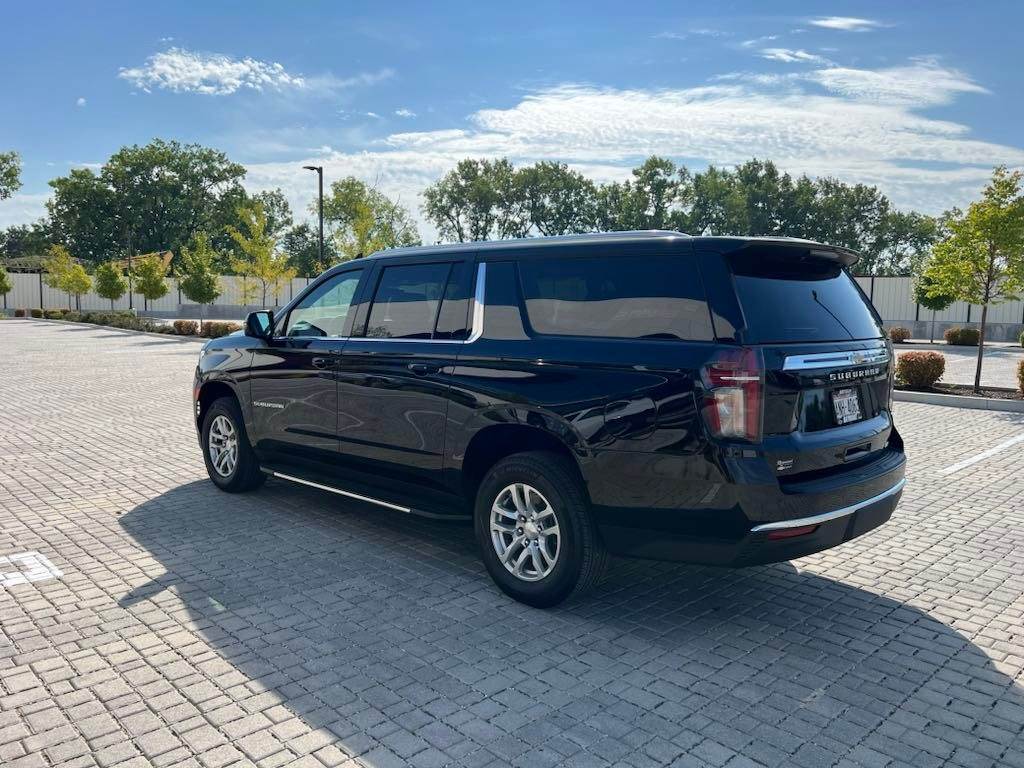 Professional luxury SUV for Chicago O'Hare airport transfers parked curbside